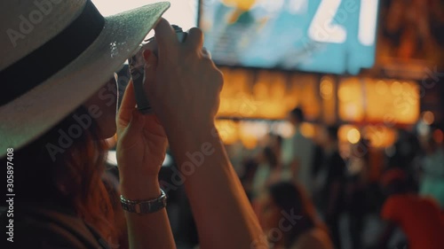 Young woman with a camera in Times Square, NYC