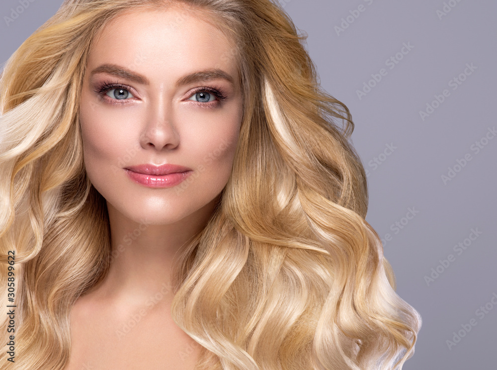 Blonde woman long curly hair face close up beautiful female natural makeup Blonde woman long curly hair face close up beautiful female natural makeup