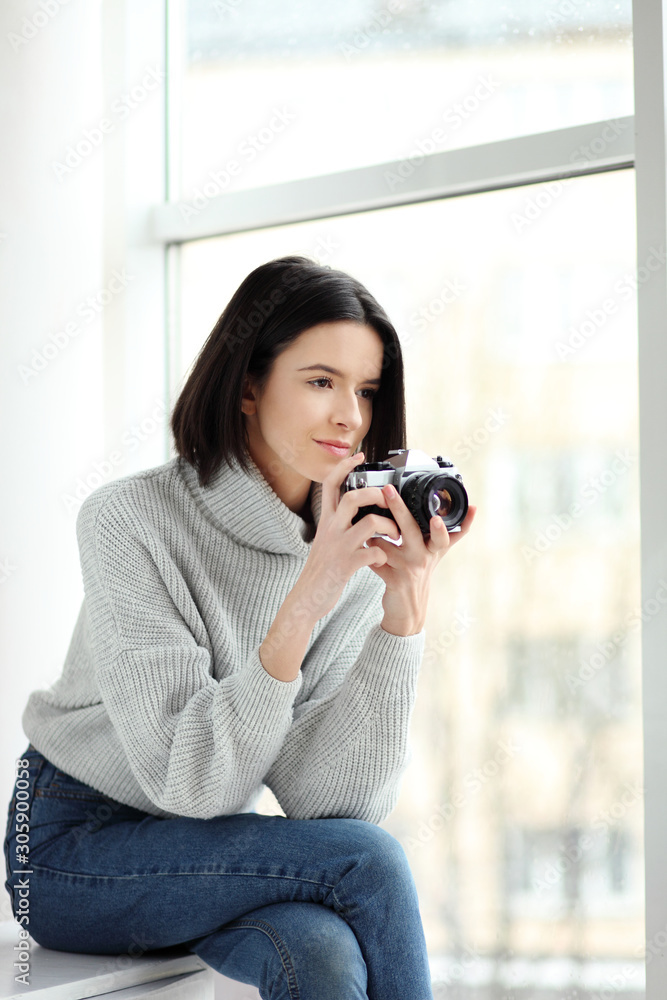 Portrait of a beautiful young woman with a camera, lifestyle Portrait of a beautiful young woman with a camera, lifestyle