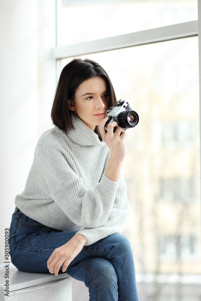 Portrait of a beautiful young woman with a camera, lifestyle Portrait of a beautiful young woman with a camera, lifestyle