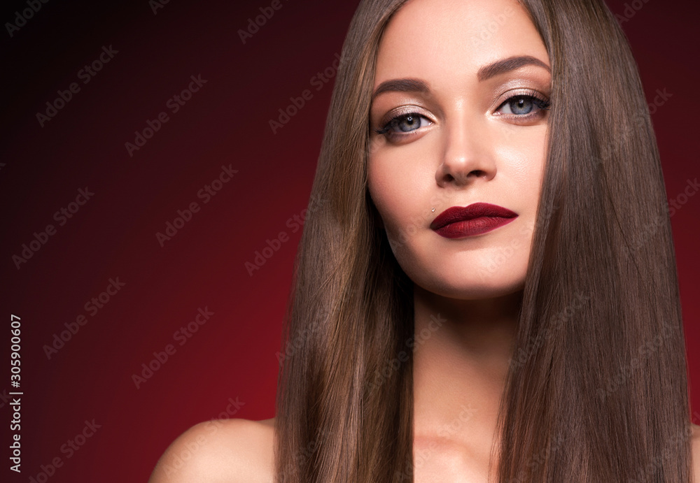 Woman beautiful make up face female red lops long smooth hair red dark background Woman beautiful make up face female red lops long smooth hair red dark background