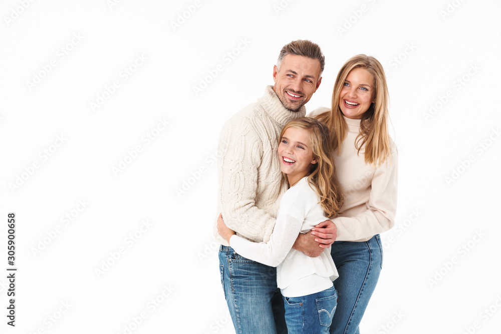 Image of caucasian family in winter clothes hugging together and smiling Image of caucasian family in winter clothes hugging together and smiling