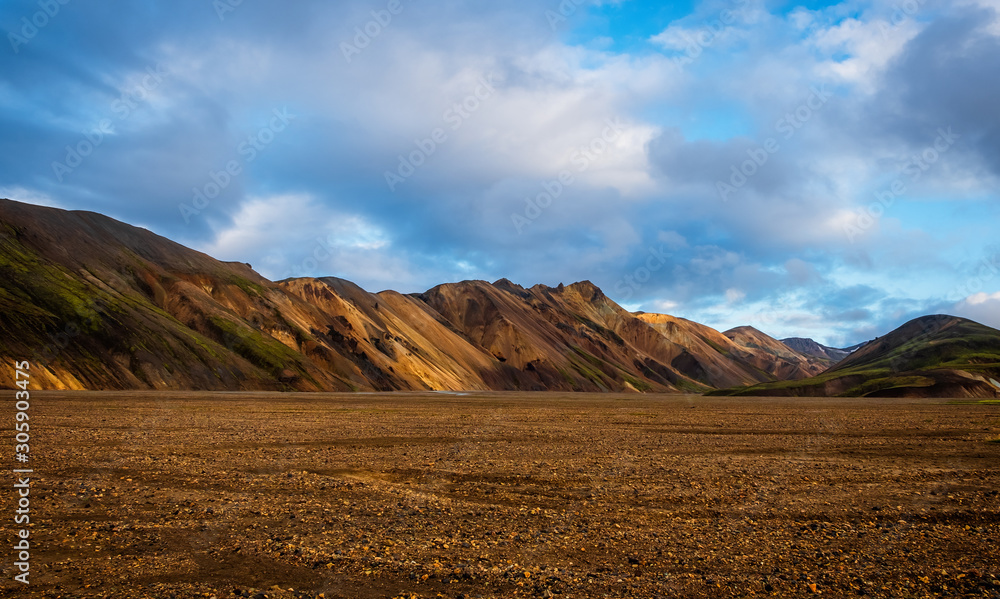 Iceland in september 2019. Great Valley Park Landmannalaugar, surrounded by mountains of rhyolite and unmelted snow. In the valley built large camp. Evening in september 2019