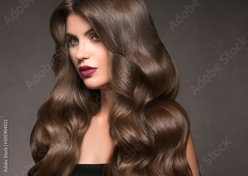 Beautiful hair woman long curly hairstyle macro face natural makeup