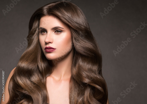Beautiful hair woman red lipstick long curly hairstyle natural makeup