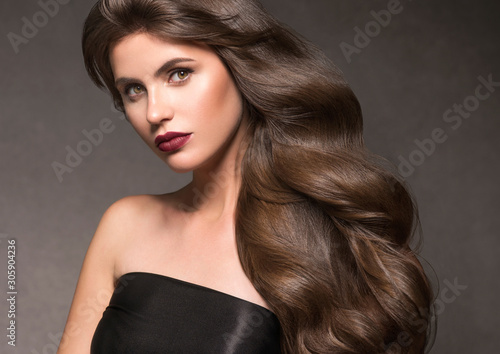 Beautiful brunette hair woman long curly hairstyle natural makeup