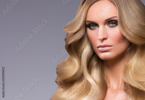 Beautiful hair woman long curly hairstyle macro natural makeup