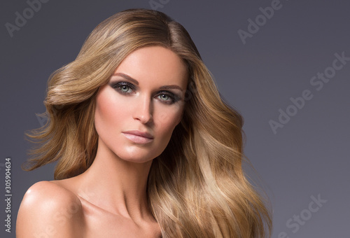 Beautiful blonde hair woman long curly hairstyle natural makeup