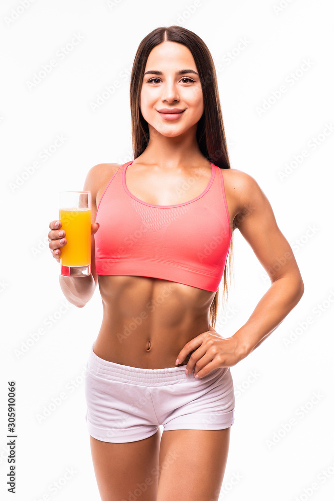 Resting time. Attractive young woman in sports wear drink juice. Organic food and health concept. Resting time. Attractive young woman in sports wear drink juice. Organic food and health concept.