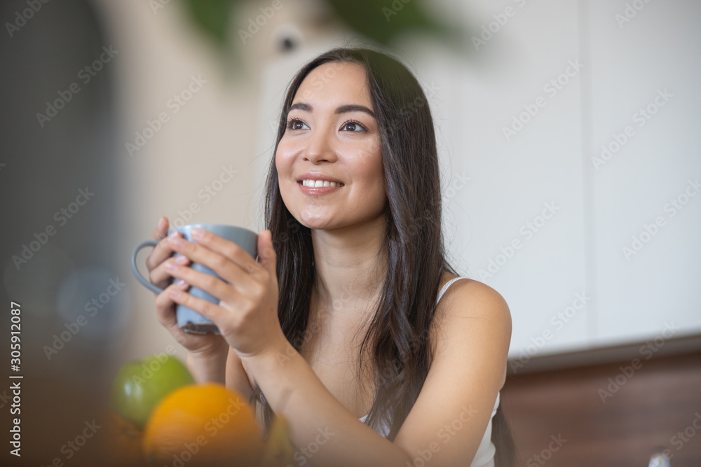 Joyful good-looking lady looking into the distance Joyful good-looking lady looking into the distance
