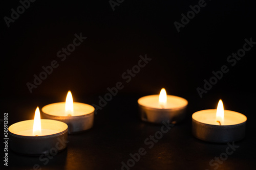 Funeral concept represented by warm candles. Religion concept.
