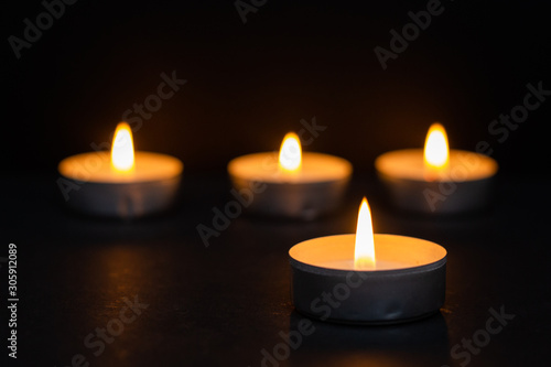 Funeral concept represented by warm candles. Religion concept.