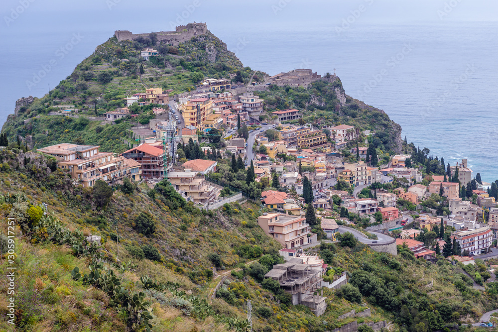Ruins of Saracen castle in Taormina seen from Castelmola, small town on Sicily Island, Italy