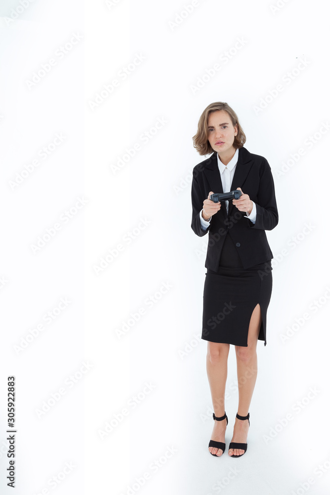 Beautiful women wearing suits are playing games with determined gestures There is relaxation from working on a white background in the concept of business success and relaxation from work. Beautiful women wearing suits are playing games with determined gestures There is relaxation from working on a white background in the concept of business success and relaxation from work.