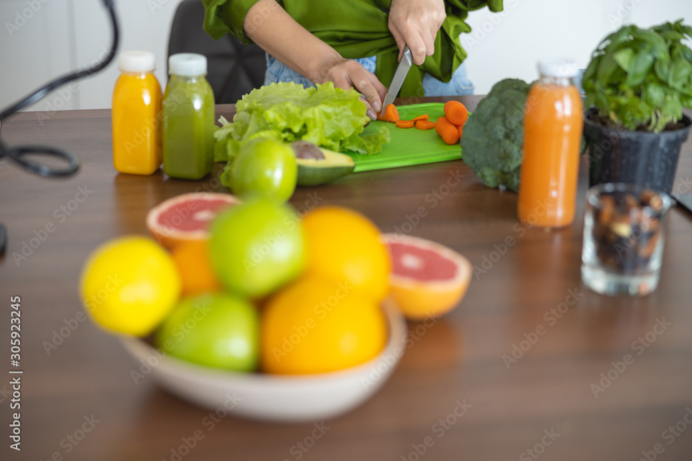 Lady chopping vegetables on the cutting board Lady chopping vegetables on the cutting board