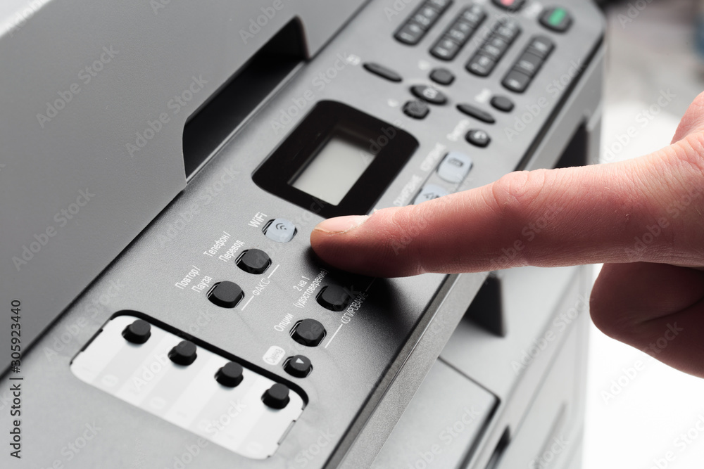 Hand press button on panel of printer. printer scanner laser office copy machine supplies start concept - Image Hand press button on panel of printer. printer scanner laser office copy machine supplies start concept - Image
