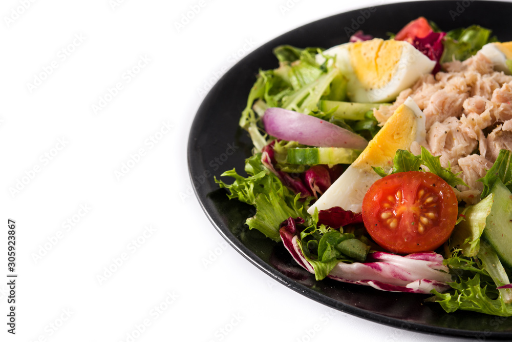 Salad with tuna, egg and vegetables isolated on white background. Copy space Salad with tuna, egg and vegetables isolated on white background. Copy space