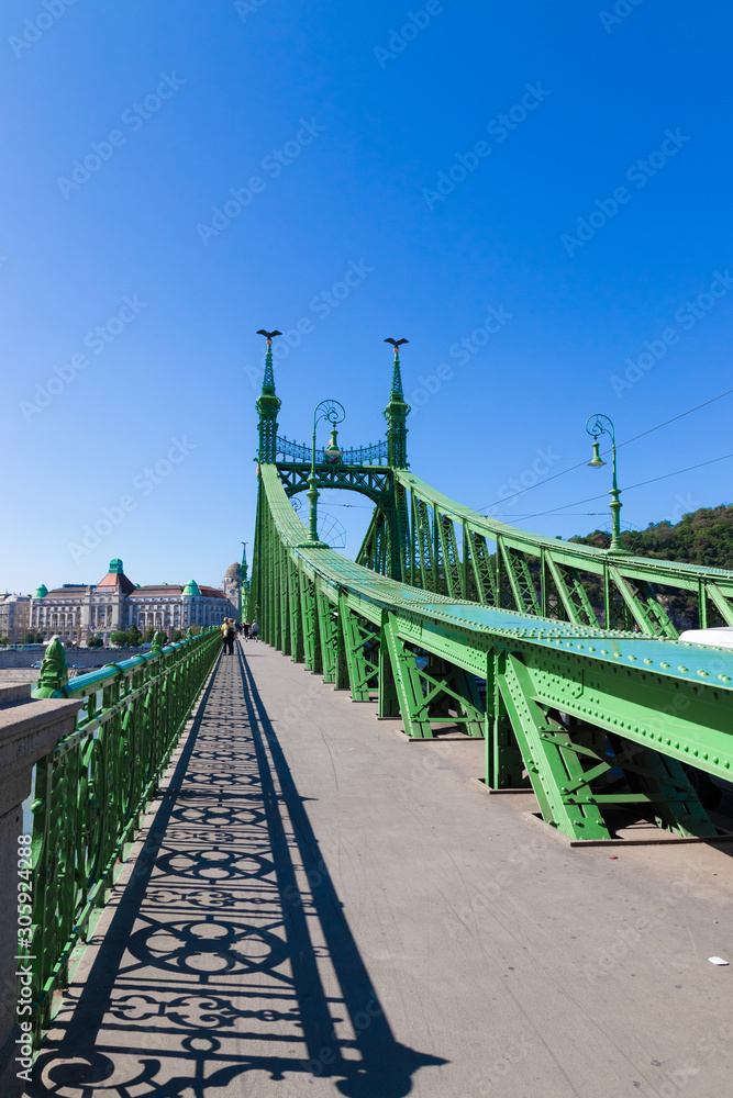 Beautiful green metal Liberty Bridge or Freedom Bridge on a summer day