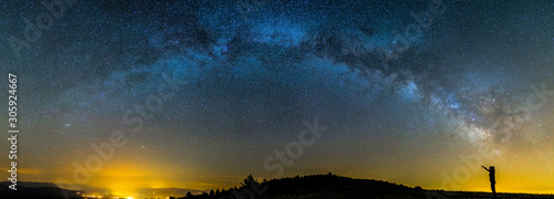 Milky way and girl in Montsec, Lleida, Pyrenees, Catalonia, Spain photo