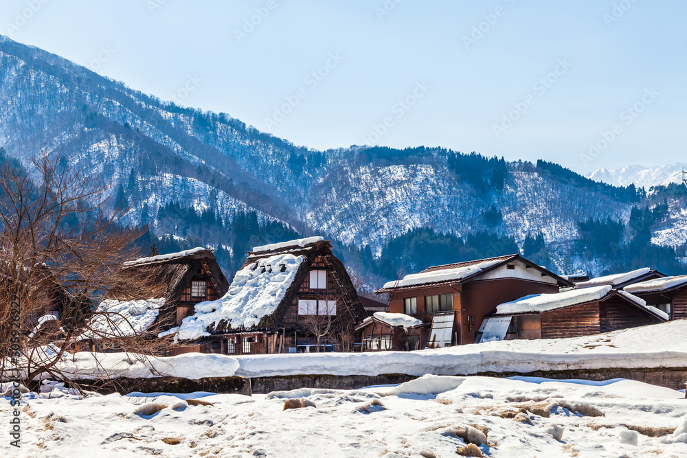 The view around the Shirakawago village, Antique style wooden house, World heritage village during the winter season with the clear blue sky and snow, Gifu, Japan