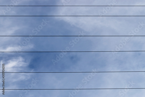 Parallel lines with the blue of the sky as background