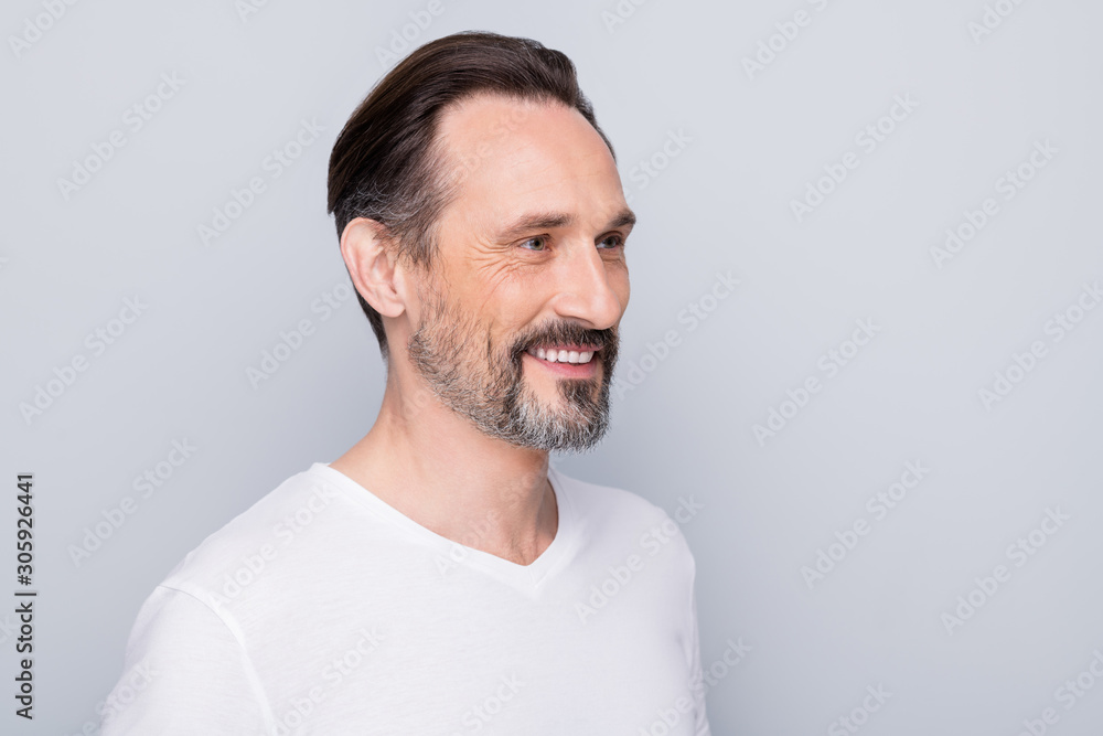 Obraz premium Closeup profile photo of handsome aged man good mood beaming smile enjoy mature appearance look younger his years wear white t-shirt isolated grey color background