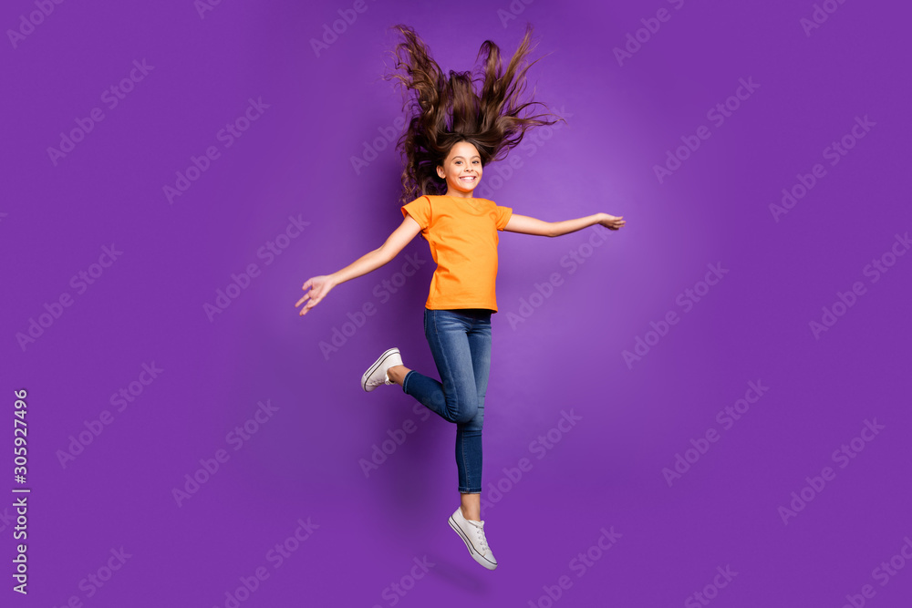Full length body size view of nice attractive lovely charming pretty cheerful cheery wavy-haired girl jumping having fun spring walking isolated on lilac purple violet pastel color background Full length body size view of nice attractive lovely charming pretty cheerful cheery wavy-haired girl jumping having fun spring walking isolated on lilac purple violet pastel color background