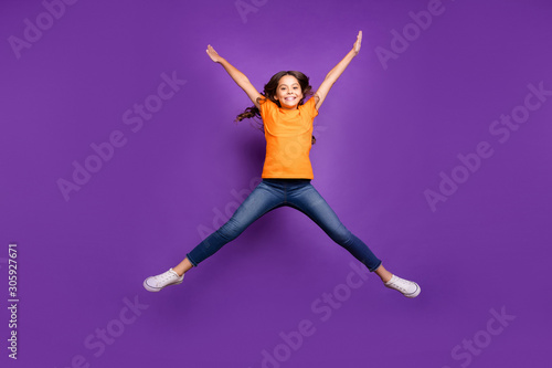 Full length body size view of nice attractive lovely cute cheerful cheery wavy-haired girl jumping having fun spring time isolated on lilac purple violet pastel color background