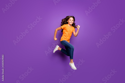 Full length body size view of her she nice attractive lovely glad active cheerful cheery wavy-haired girl jumping running spring season isolated over lilac purple violet pastel color background