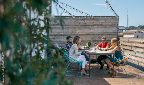 Photography Group of office workers working on the terrace of the officce