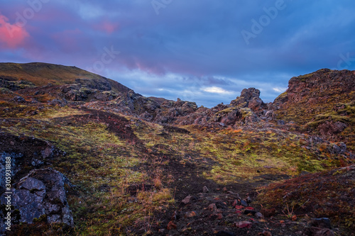 Iceland in september 2019. Great Valley Park Landmannalaugar, surrounded by mountains of rhyolite and unmelted snow. In the valley built large camp. Evening in september 2019 © Сергій Вовк