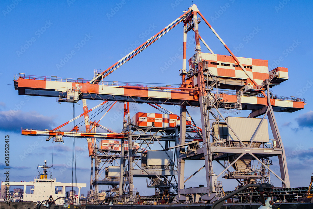 Cranes in the port for unloading cargo from ships. Cranes in the port for unloading cargo from ships.