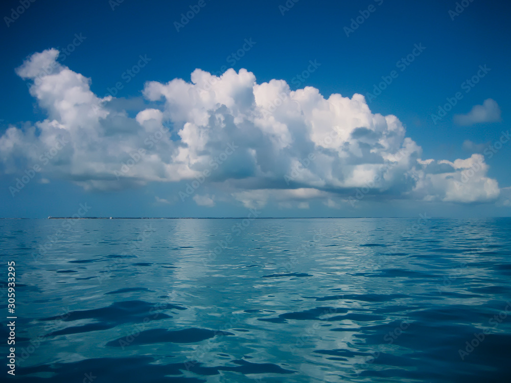 Cloudscape over the blue sea