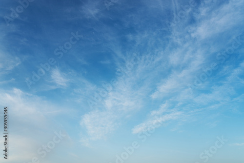beautiful blue sky with cirrostratus clouds on sunny day background photo
