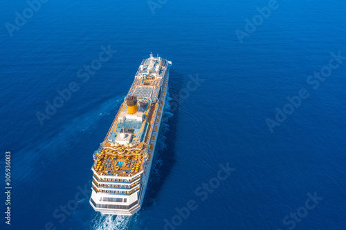 Cruise ship goes to the open ocean on a journey. © aapsky