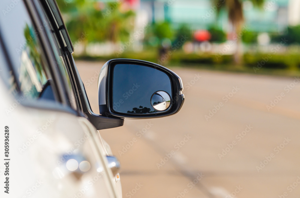 Car side mirror for rear view with road background