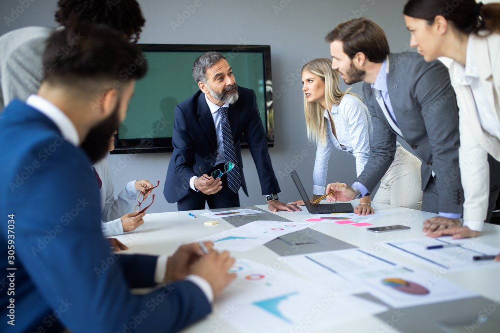 Fototapeta premium Group of happy business people working in a meeting at office