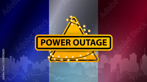 Power outage, yellow warning sign wrapped with garland on the background of the flag of France with the silhouette of the city on the background