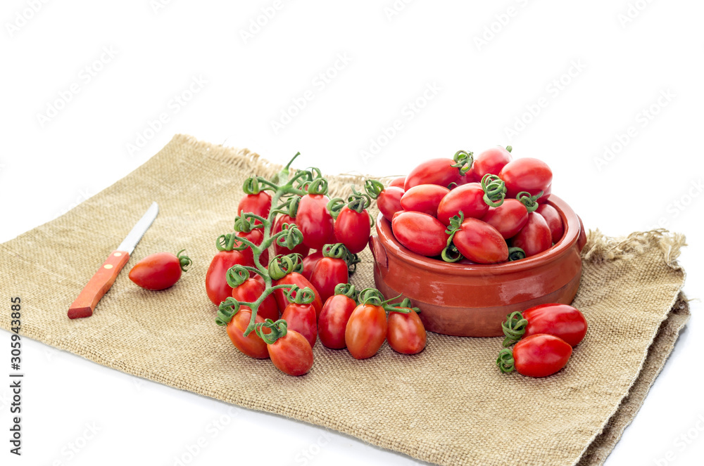 The cherry tomatoes on a white background The cherry tomatoes on a white background