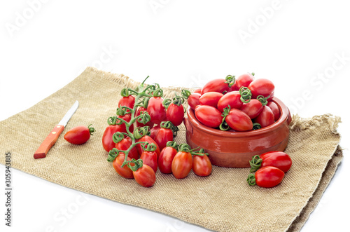 The cherry tomatoes on a white background