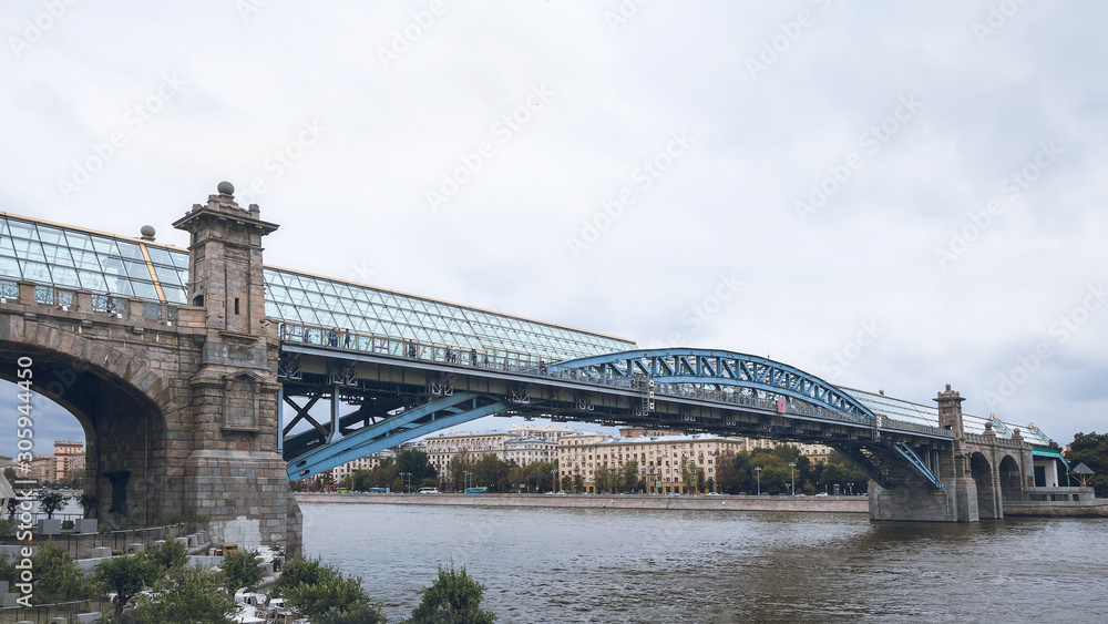 Glazed pedestrian bridge over the Moscow river.