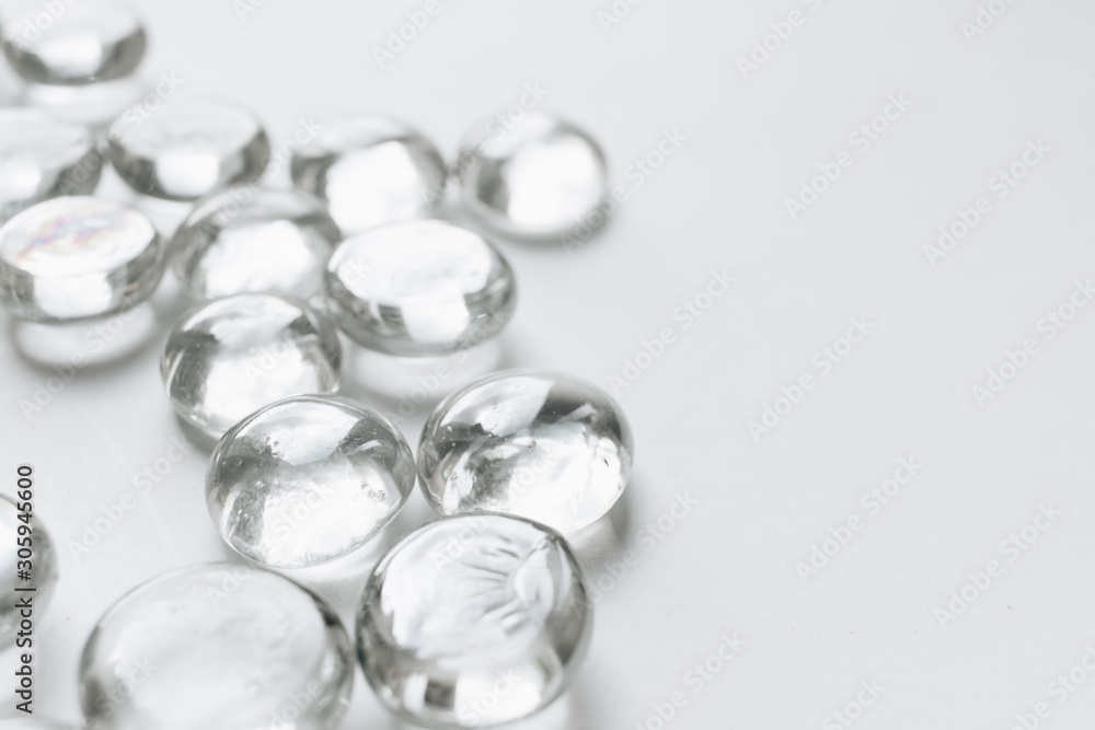 Scattered crystals on white background, beautiful gems Scattered crystals on white background, beautiful gems