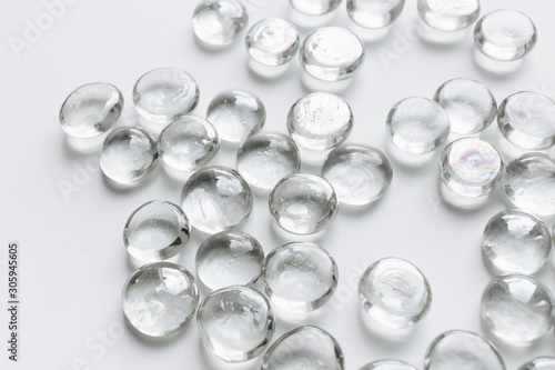 Scattered crystals on white background, beautiful gems