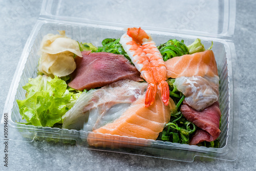 Take Away Sashimi Salad with Wakame, Seaweed, Salmon, Sea Bass, Shrimp, Kani, Mackerel Fish, Tuna in Plastic Box Package / Container.