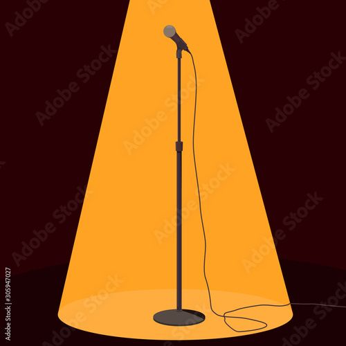 Microphone with stand under spotlight