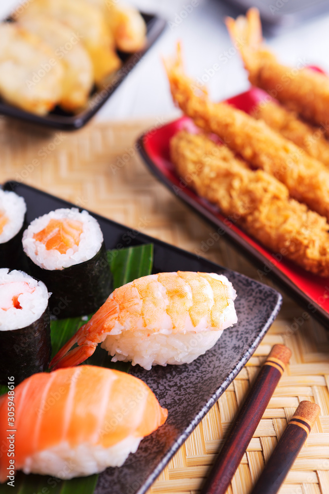 Shrimp tempura and various Japanese sushi on a plate Shrimp tempura and various Japanese sushi on a plate