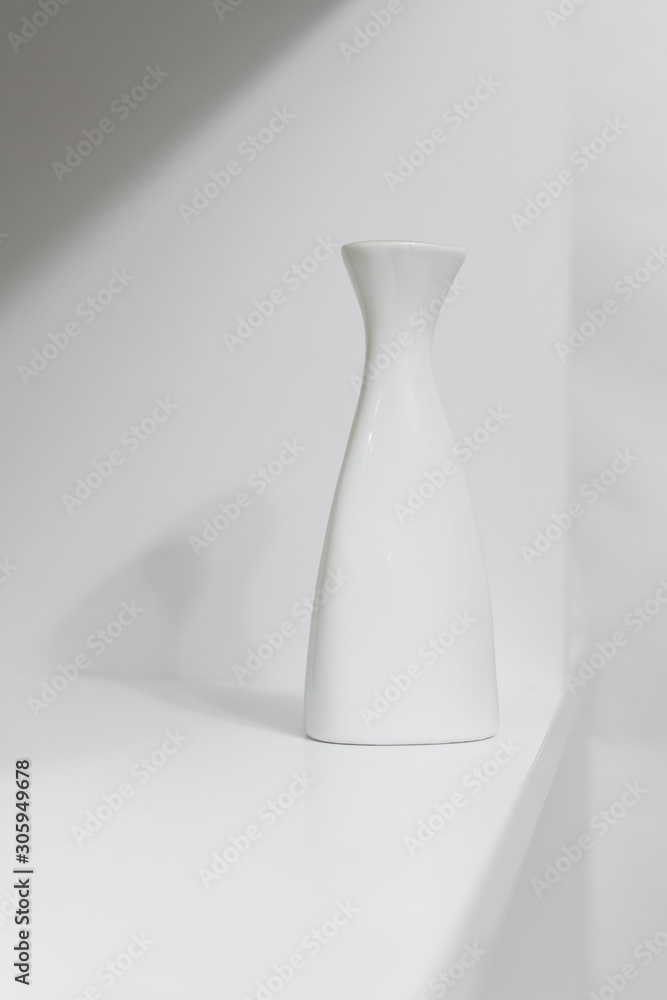 White vase on a wall background White vase on a wall background