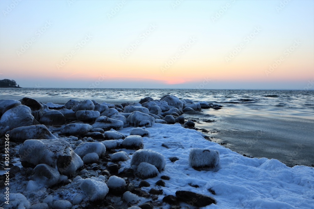 cold winter day at the Baltic Sea Coast witz frozen rocks 