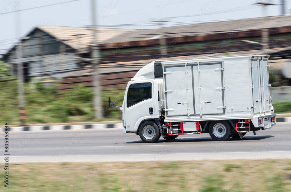 Motion image, Small white truck for logistics on the road.