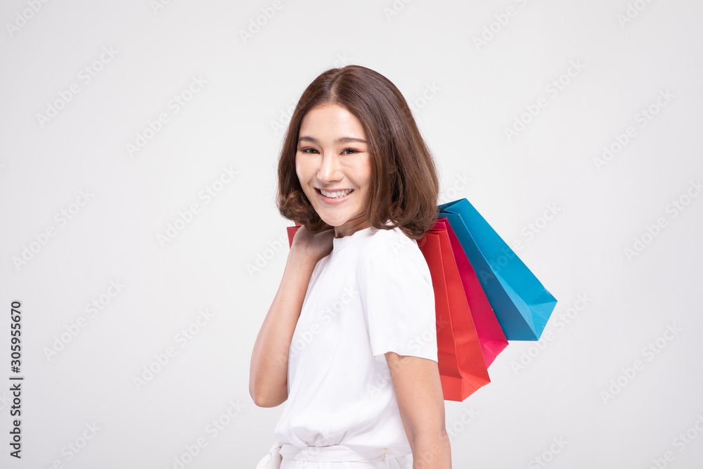Shopping Asian woman with short hairs smile and Holding Shopping bags, Cheerful and happiness emotional, Enjoy Shopping in black friday sale, Isolated on gray background, Shopping Concept Shopping Asian woman with short hairs smile and Holding Shopping bags, Cheerful and happiness emotional, Enjoy Shopping in black friday sale, Isolated on gray background, Shopping Concept
